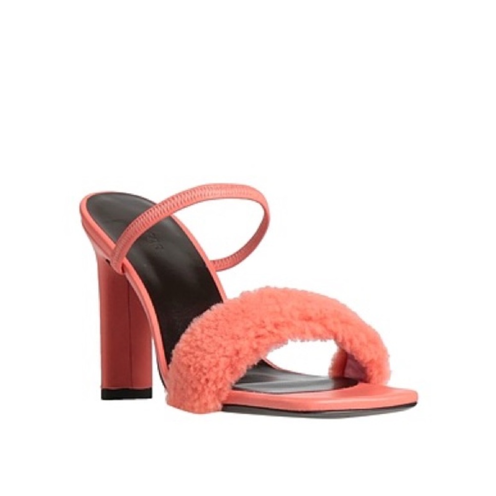 By Far pink shearling heels